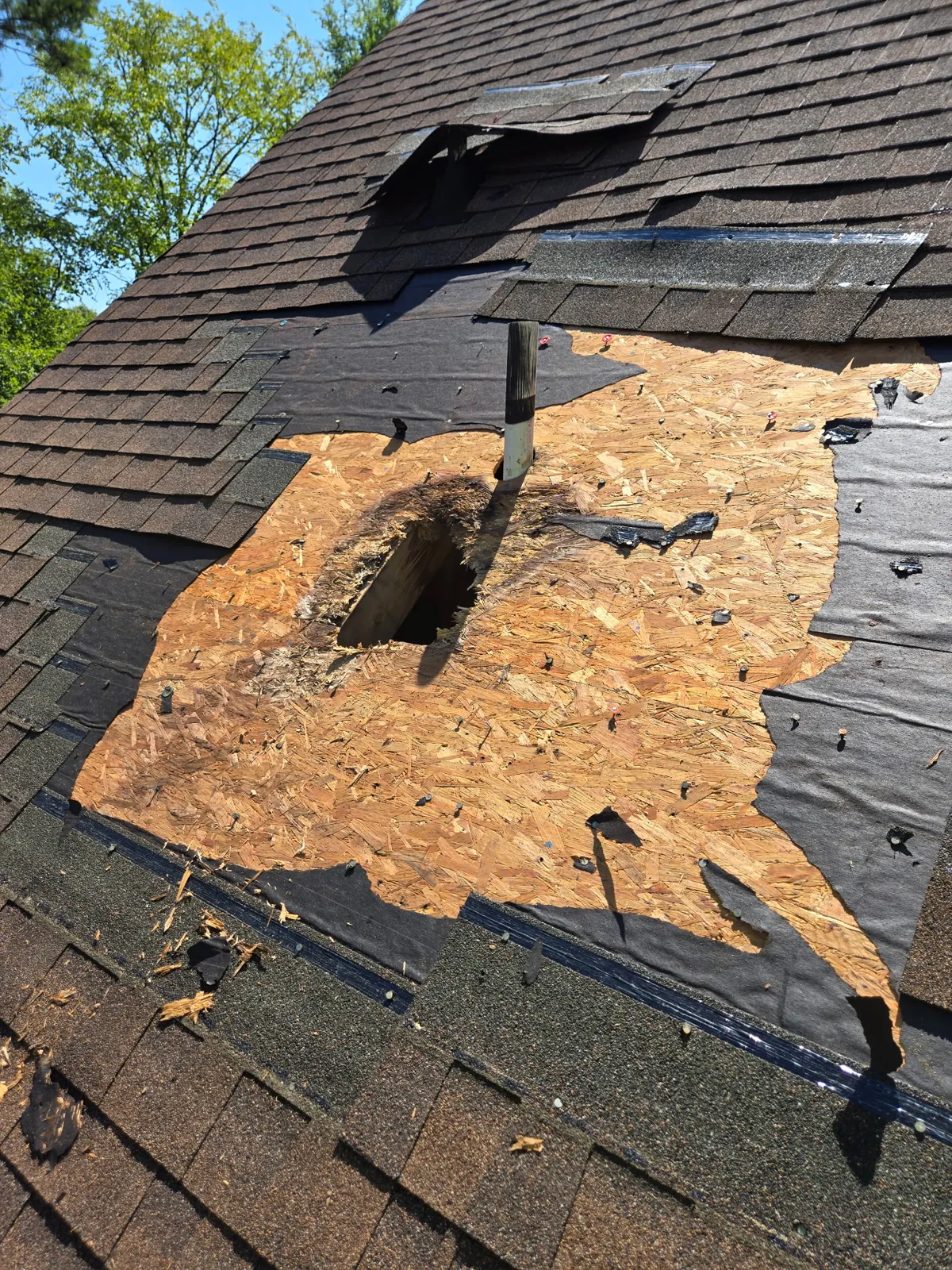 Roof repair rotted decking hole exposed